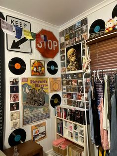 a room filled with lots of records and posters