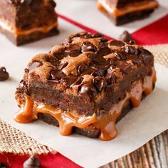 chocolate dessert with caramel drizzle on top and pieces of cake in the background