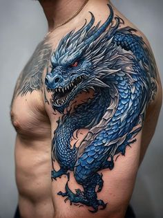 a man's chest with a blue dragon tattoo on his left arm and shoulder