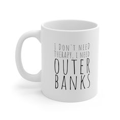 a white coffee mug that says i don't need therapy, i need outer banks