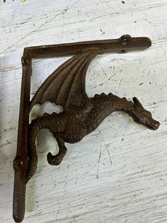 an old cast iron door handle with a dragon on it