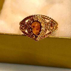 Pretty Avon Ring, Glistening Touch. Citrine Colored Glass Stone. Size 7 New In Box.This Ring Was Made In 1979, Its Brand New In The Box For 45 Years. Absolutely Perfect. Antique Carnelian Rings For Gifts, Luxury Red Carnelian Signet Ring, Collectible Red Carnelian Ring, Avon Rings, Avon Bronzing Pearls, Ruby Red Glassware Vintage Avon, Avon Jewelry, Womens Jewelry Rings, Colored Glass