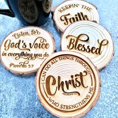 four wooden coasters with the words god's voice and christ printed on them