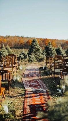 rows of chairs and rugs lined up on the ground