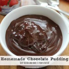 homemade chocolate pudding in a white bowl on a wooden table