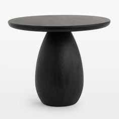 a black table with a wooden top on a white background in the shape of a vase