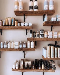 the shelves are filled with many different types of beauty products and hair care products on them