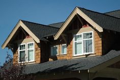 three windows on the roof of a house