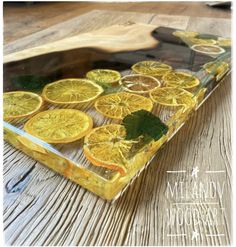 orange slices in a glass dish on a wooden table