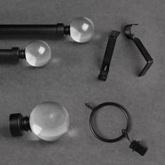 an assortment of different types of lights on a gray surface with keychains and clippings