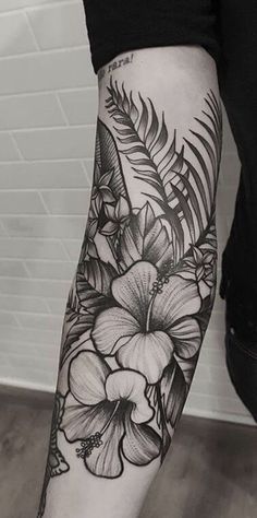 a person with a flower tattoo on their arm