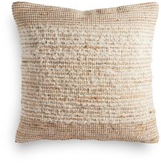 a brown and white pillow on a white background