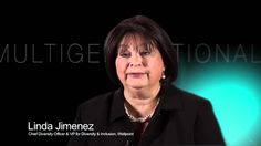 a woman is sitting in front of a black background with the words multgee national on it