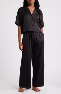 You won't be in any hurry to get dressed in the morning when you're in these relaxed-fit satin PJs featuring a boxy, button-up crop top and matching pants. Top has front-button closure; notched collar; elbow-length sleeves; chest patch pocket Bottoms have elastic waist; side-seam pockets 97% polyester, 3% spandex Machine wash, tumble dry Imported Satin Pjs, Satin Pajamas, Matching Pants, Notched Collar, Elbow Length Sleeve, Fabric Gifts, Free Fabric, Get Dressed, In The Morning