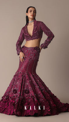 Featuring our whimsical wine jeweled lehenga paired with a stylised blouse that is a beautiful amalgamation of opulence and charm.
Accented with sparkly jewels this fish cut silhouette wraps your curves with elegance and grace.
The stylized blouse elevated with feminine trail draping and wide neck fit complete this grandeur effortless look. Fish Cut Lehenga, Couture 2024, Fish Cut, Dresses Traditional, Embellished Jacket, Stylish Party, Stylish Party Dresses, Indian Fashion Dresses, Indian Designer