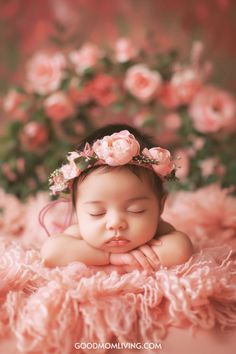 A peaceful baby girl sleeping on a soft pink blanket, adorned with a floral crown made of pink roses, surrounded by a background of blooming flowers. Unique Girl Names