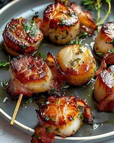 some food is sitting on a plate with toothpicks and garnishes