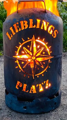 a fire pit with the words helling's plat on it and an image of a compass