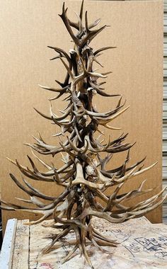 an antler christmas tree is on top of a table