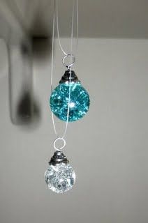 a glass ornament hanging from a hook