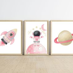 three pictures of children's wall art with space and rockets in pink, gold and white