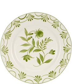 a green and white plate with leaves on it