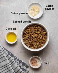 ingredients to make chickpea patties in bowls on a table with flour, salt and oil