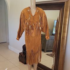 Vtg Suede Leather Fringe, Feathers & Beads. Western Native American Pullover Dress From Late 70's Pre-Owned, Vintage, Does Have One Area Of Light Spots. See Pictures No Holes Or Stiffness In The Leather Approx Measurements Laying Flat: 22" Pit To Pit 19 " Shoulder To Shoulder 43" Total Length 21" Sleeves Light Spots, Sleeve Women, Leather Fringe, Suede Leather, Shoulder To Shoulder, Women Long Sleeve, Nativity, See Pictures, Feathers