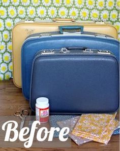 a blue suitcase sitting on top of a wooden floor next to a yellow flowered wall