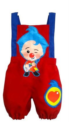 a child's red and blue overall with clown face on the front, one button down