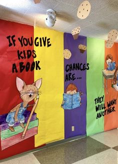 colorful bulletin boards with children's books written on them in the hallway at an elementary school