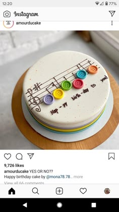 a cake decorated with musical notes and buttons