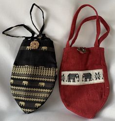 "Note: When placing an order, please specify a black or red bag - Very Rare collection - Handcrafted in Thailand, Dimension - H - 9\" x W 6 x D 5 1/2\" - Silk blended Black & cotton Red bag - Sturdy to carry This listing is for one bag either a black or red bag. These bags are designed in papaya or acorn fruit shape. They are sturdy to carry your personal belonging. The black bag is made from silk blended in elephant design. The red bag is made from Thai cotton. Both bags have linning and the kn Traditional Black Pouch Bag, Traditional Black Shoulder Bag For Gift, Traditional Black Shoulder Bag As Gift, Traditional Black Shoulder Bag Gift, Eco-friendly Red Gift Bag, Casual Black Pouch For Gift, Black Eco-friendly Bag As Gift, Eco-friendly Black Shoulder Bag Gift, Eco-friendly Black Bags For Gifts