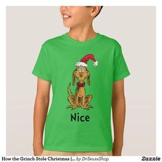 a young boy wearing a green t - shirt that says nice