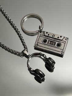 "The ultimate present for him: A sleek Stainless Steel Vintage Cassette Keychain. Headphone pendant option available.  Functional, Fashionable & Durable Men's Stainless Steel. Stainless Steel Vintage Cassette Keychain - Perfect Gift for the DJ, Musician, or Music Lover in your life. Amazing detail. Length 1.5\" Width 3/4\" Whether you are buying for yourself or the man/woman in your life, this is going to be the piece that you/he/she will love for years to come!  K E E P * I N * T O U CH https:/ Dj Gifts For Men, Guy Keychain Ideas, Gifts For Musicians Boyfriend, Cool Key Chains, Headphone Keychain, Masc Jewelry, Music Related Gifts, Skateboard Jewelry, Cool Objects