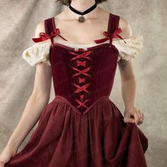 Our dark red velvet corset is the ultimate statement piece for those seeking a blend of luxurious elegance and historical charm. Perfect for renaissance faire costumes, Christmas parties, gothic or vampire outfits, or simply adding a bold, regal touch to your wardrobe, this corset is designed to flatter your silhouette while offering comfort and durability. Crafted from rich, 100% cotton deep red velvet, this corset features a classic lace-up front and back lacing for an adjustable fit, and synthetic whalebone boning for structure and support. Pair it beautifully with our linen skirts or petticoats, or style it with high-waisted jeans for a modern twist. Welcome to French Meadows, your dream shop for Renaissance Faire Costumes, including CottageCore corset tops, Renaissance corsets and bod Royal Vampire, French Meadows, Vampire Outfits, Cottagecore Corset, Cottagecore Princess, Velvet Corset Top, Linen Skirts, Dark Red Velvet, Vampire Clothes