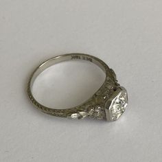 This is Rare Opportunity to get your hands on a real vintage engagement ring! Chance are you will never see another one like it so this is a chance to give your engagement a really unique and special touch with history and true craftsmanship!!! The ring comes with an Appraisal Certificate from a reputable local jeweler!! (Included with purchase!) - see photo. 18K White Gold engagement ring with 0.38 ct carat diamond. The ring is stamped “DEE 18k”. Please review photos for all the details. The old European cut diamond is hand-cut and it has a beautiful sparkle I have tried to capture in the photos in different lighting. The ring has beautiful dainty floral detail. It’s a gorgeous ring with exceptional detail and chances are you’ll never see another one like it!!! Feel free to ask questions. Unconventional Engagement Rings Silver, Non Traditional Wedding Rings Engagement, Alternative Engagement Rings Silver, Engagement Rings Silver Vintage, Simple Silver Engagement Rings, Hippie Engagement Rings, Victorian Rings Engagement, 1950s Engagement Ring, Unconventional Engagement Rings