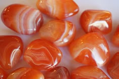 This listing is for one of medium carnelian tumbles. They average 8 grams in weight. Carnelian is red agate. These carnelian are a rich warm orange, with banding. They are tumbled and polished nicely. One with banding will be hand selected for you. Most of these look like plain carnelian on one side, and banded on the other. Origin: Brazil Mohs Hardness Scale: 7 Some of us are just beginning our relationship with rocks and crystals. Choosing a rock or crystal is Intuitive... be Intuitive...and h Natural Carnelian Gemstones, Carnelian Natural Stones In Amber, Banded Carnelian, Crystals Carnelian, Spiritual Round Carnelian Gemstones, Crystal Carnelian, Hardness Scale, Orange Gem