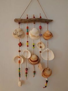 a wind chime with seashells hanging from it