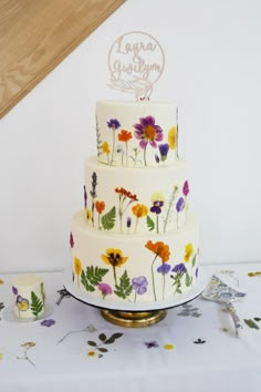 a wedding cake with flowers painted on it