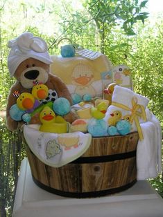 a teddy bear sitting in a basket filled with toys