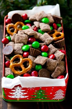 a box filled with christmas treats on top of a wooden table