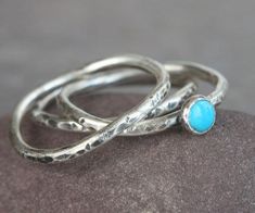 These "wave" rings are each individually handcrafted in my studio. An American blue turquoise (4mm) is set on one of these "free waves". I patined the rings and hand polished them to show off their individual characters. Other gemstones are also available. Come ready in a gift box. This listing is for a set of three rings similar to the ones in the photos. Each piece is made to order so please allow 1-2 weeks BEFORE shipping via USPS first class mail. Please check shop announcement for current s Stack Rings, Silver Turquoise Jewelry, Sterling Silver Stacking Rings, Wave Ring, Three Rings, Silver Stacking Rings, Nalu, Genuine Turquoise, Jewelry Inspo