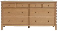 a wooden dresser with many drawers and knobs on the bottom drawer, against a white background