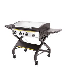 an outdoor grill with wheels on the side and a white back dropper over it