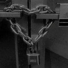 black and white photograph of a heart shaped padlock