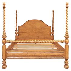 a wooden bed frame with four posts