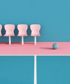 three pink chairs sitting on top of a tennis court with a ball in the middle