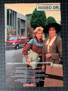 an advertisement for gmc featuring two women in front of a city street with cars