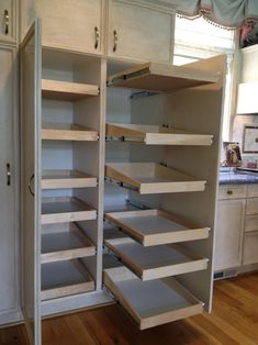 an empty pantry with lots of shelves in it